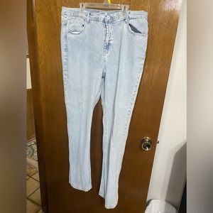 Light blue denim jeans.  Rhinestones on back pockets.  Size 16.  Diane Gilman